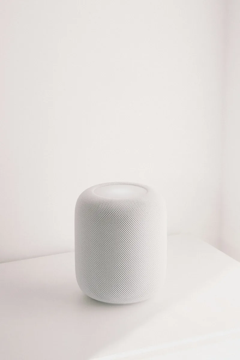 White smart speaker on a white surface